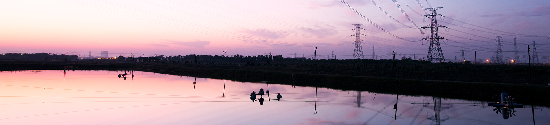 high voltage transmittion tower and landscape during sunset